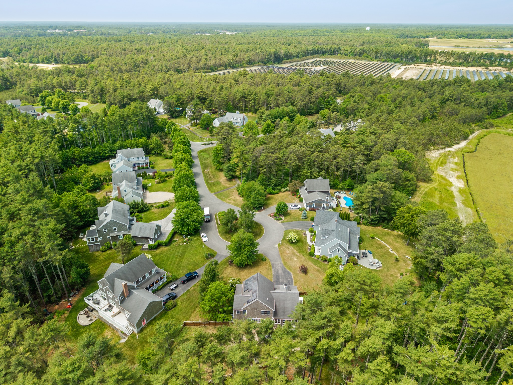 Aerial view of the neighborhood and surrounding landscape