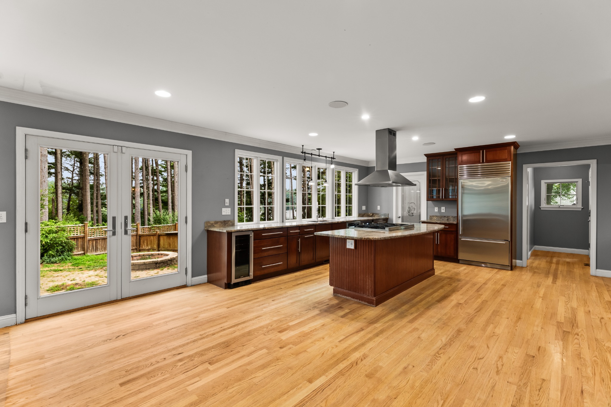 Open-concept kitchen with walls of windows